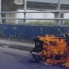 Sebuah motor dengan bak di samping terbakar di kawasan Jembatan Meikarta, Minggu (16/8/2026). Penyebab kebakaran masih belum diketahui.